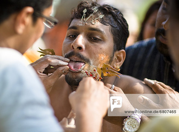 A Young Man In A Ritual Of Tongue Piercing  India