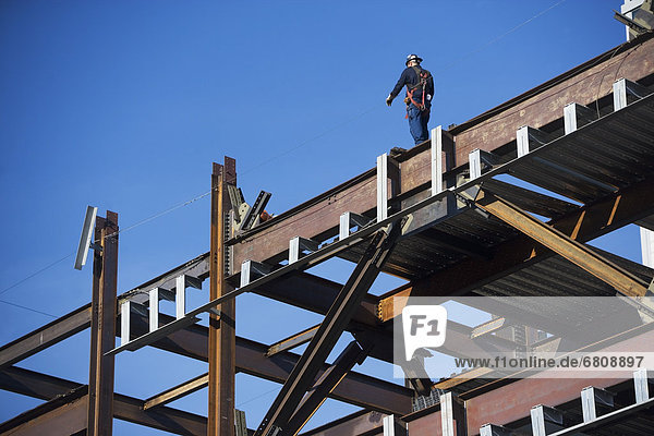 Construction worker on construction frame