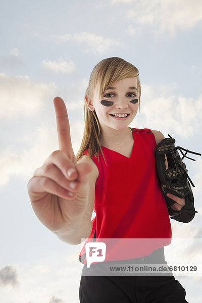 Portrait of girl (12-13) plying softball