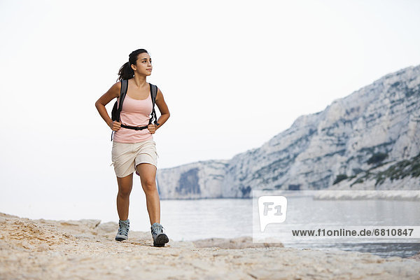 France  Marseille  Woman hiking on seaside