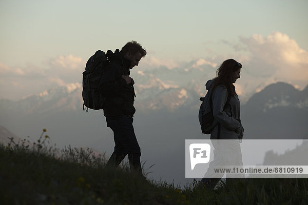 Switzerland  Leysin  Hikers marching through Alpine landscape