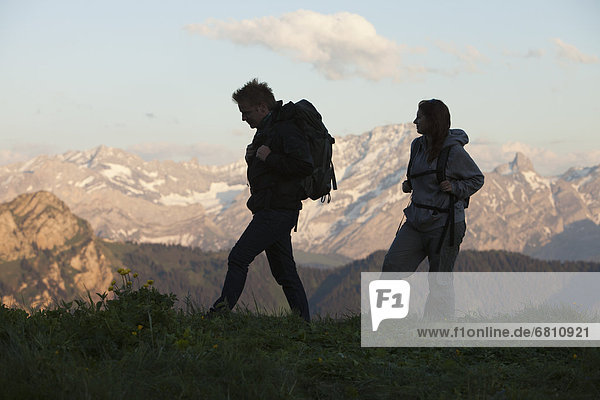 Switzerland  Leysin  Hikers marching through Alpine landscape