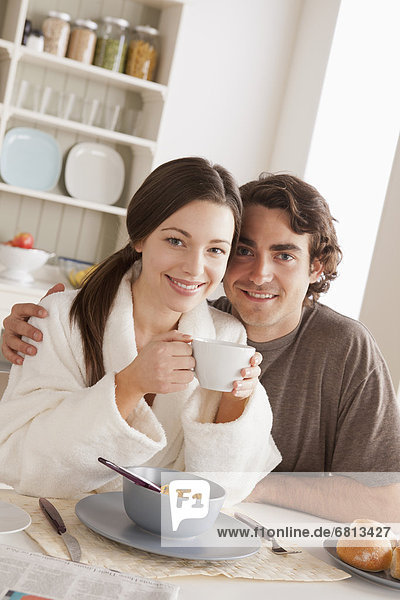 Portrait of young couple at breakfast