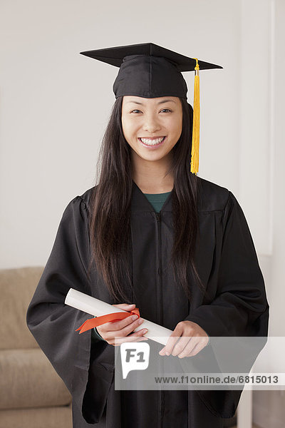 Portrait of graduated young woman