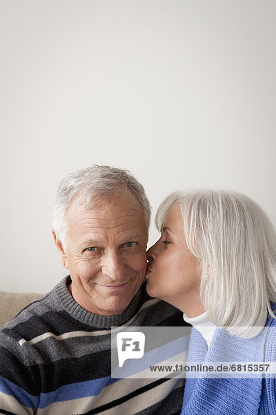 Senior couple  woman kissing man