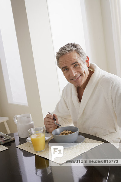 Man having cereal for breakfast