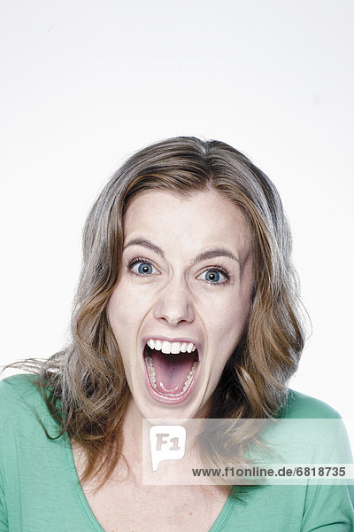 Portrait of screaming young woman  studio shot