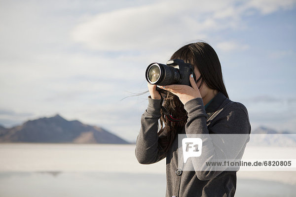 USA  Utah  Salt Lake City  Young woman taking photos