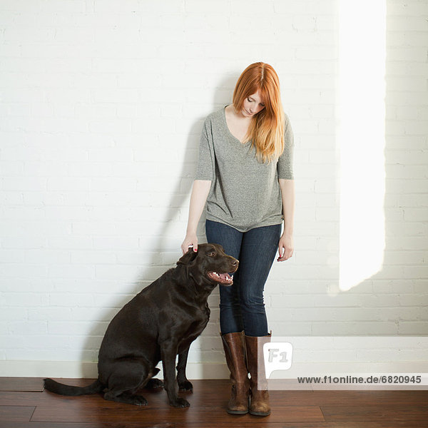 Portrait of attractive young woman and her dog