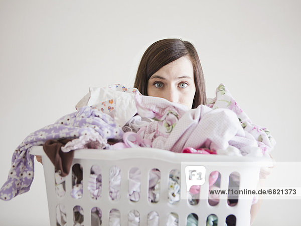 Young woman doing laundry