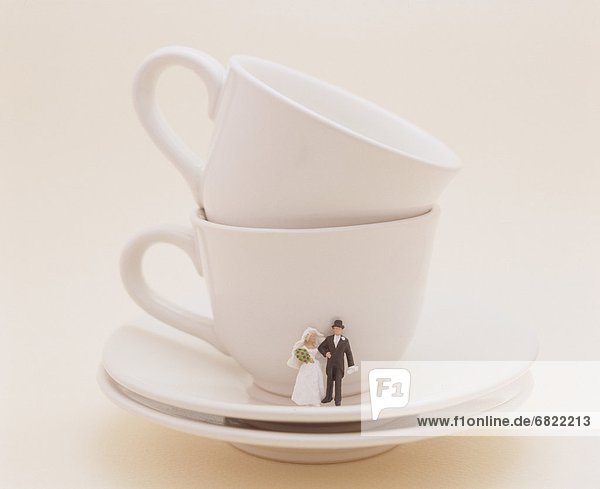 Bride And Groom On Saucer