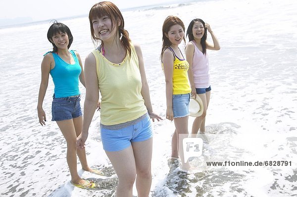 Four friends on the beach