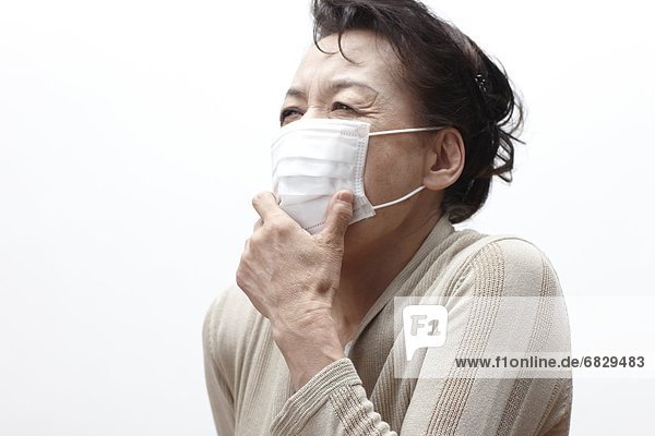 Frau Chirurgie Kleidung Maske husten