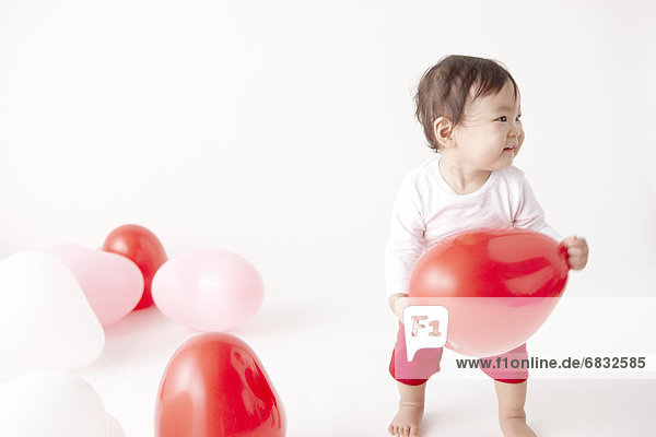 Baby in Midst of Balloons