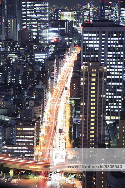 Office buildings and streets in the night  long exposure  Tokyo prefecture  Japan