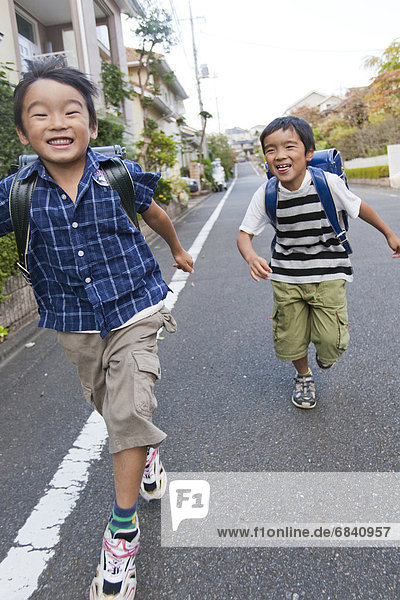 Boys running  Tokyo Prefecture  Honshu  Japan