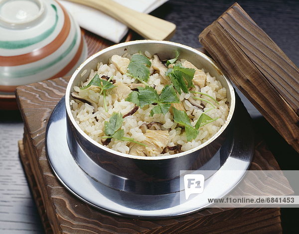 Bowl of rice cooked with chicken