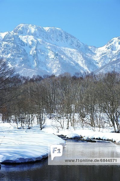 The Togakushi Mountain Range and the Torii River in Winter. Nagano Prefecture  Japan
