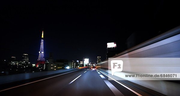 Car point of view of a highway road and Tokyo Tower. Tokyo Prefecture  Japan