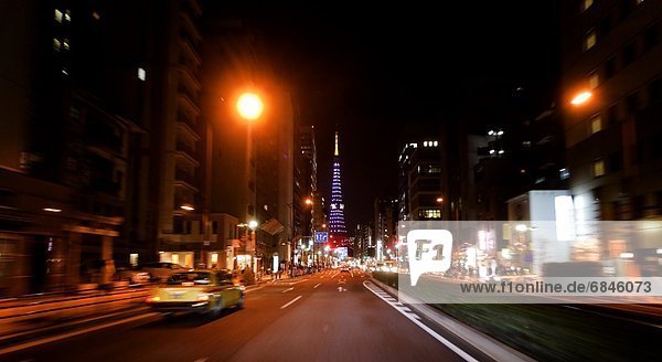 Car point of view of a highway and Tokyo Tower at night. Tokyo Prefecture  Japan