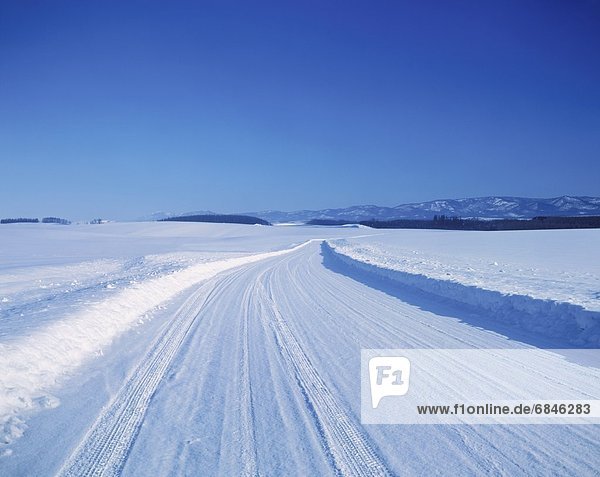 4x4 on a snow covered road  Biei  Hokkaido  Japan