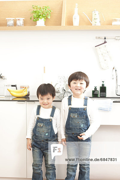 Portrait of brothers in a kitchen