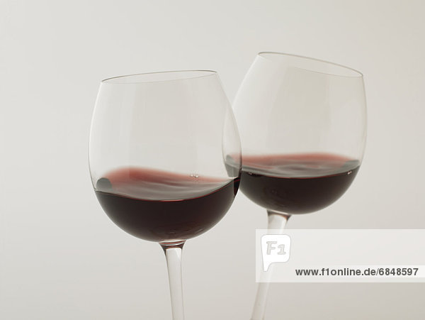 Glasses of red wine  close up  white background