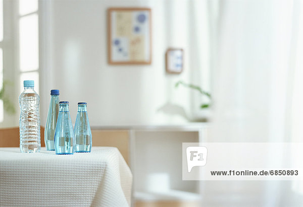 Bottles of water on table