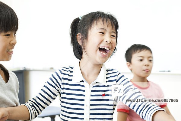 Girl laughing at cram school