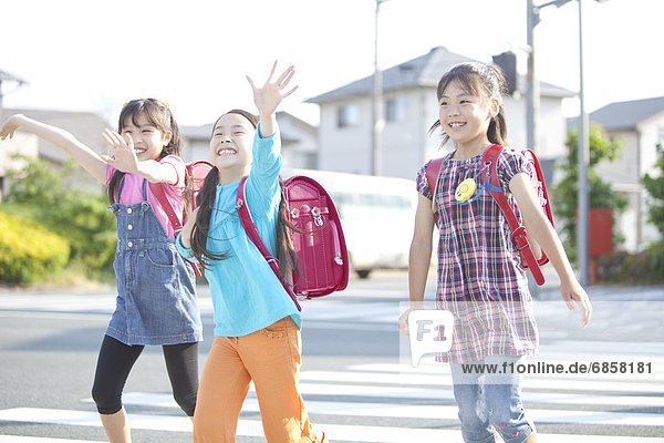 Schoolgirls crossing street  Japan