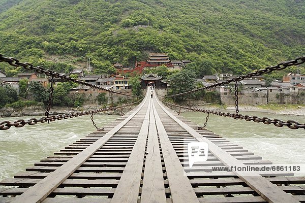 Luding Bridge Leading Towards Traditional Chinese Buildings. Sichuan Province  China