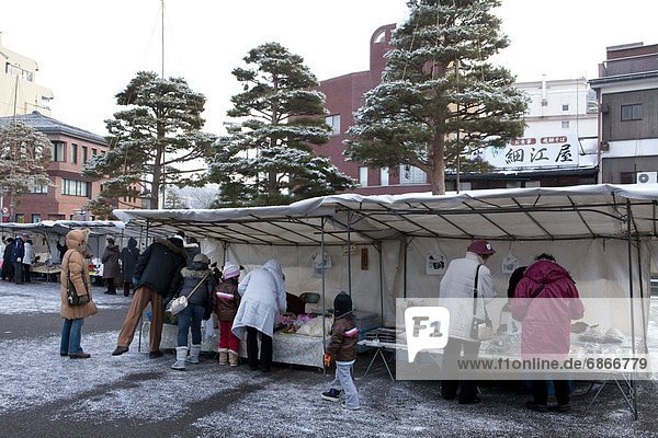People Shopping in Market in Winter