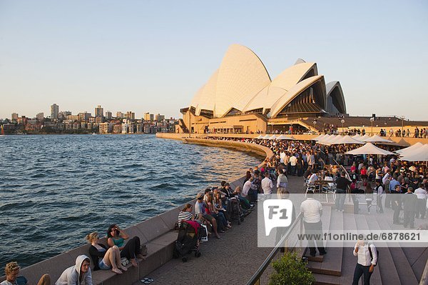People enjoying the evening in Sydney  drinking at the Opera Bar in front of Sydney Opera House  UNESCO World Heritage Site  Sydney  New South Wales  Australia  Pacific