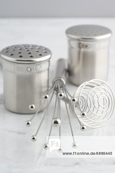 Salt and Pepper Shakers and Whisk