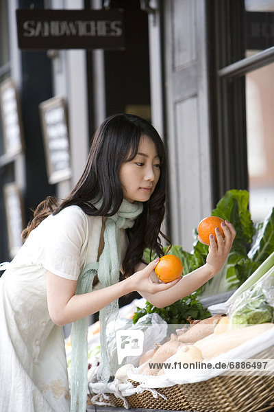 Young Woman Shopping Fruits