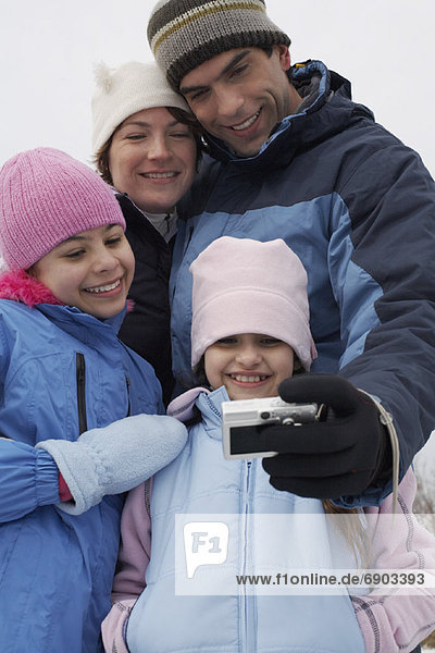 Father Taking Picture of Family