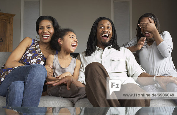 Family Watching Television Together