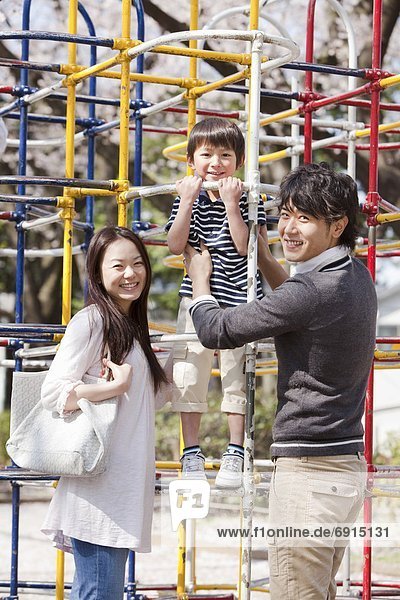 Parents and Son in Playground