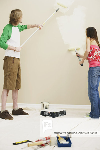 Couple Painting Home
