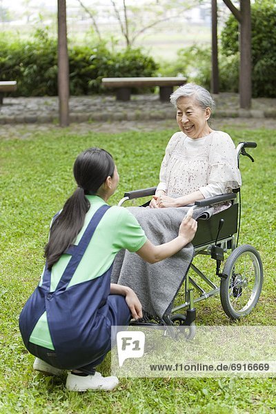 Nurse Talking to Senior Woman