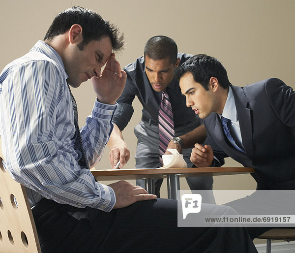 Businessmen in Meeting  Looking Frustrated