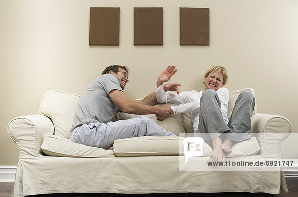 Couple Arguing on Sofa