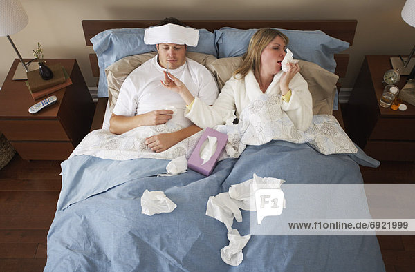 Sick Couple in Bed