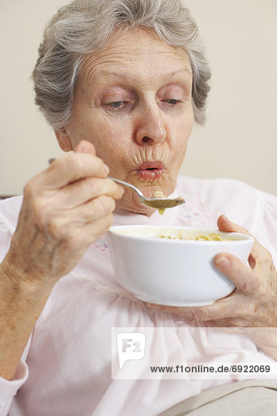 Woman Eating Chicken Soup
