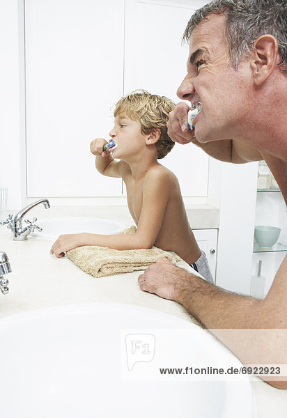 Father and Son Brushing Teeth