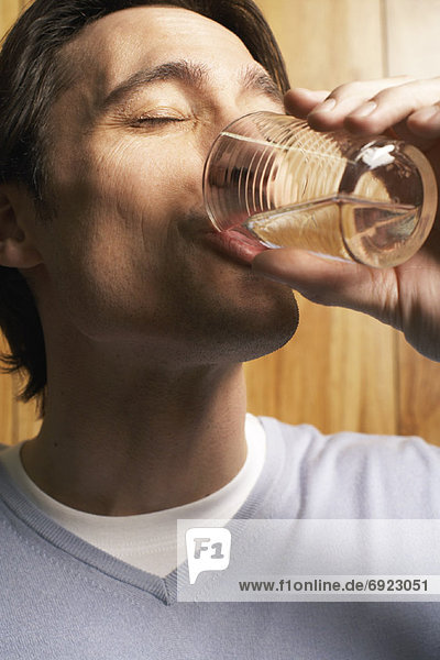 Man Drinking Glass of Water