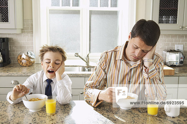 Father and Son Having Breakfast
