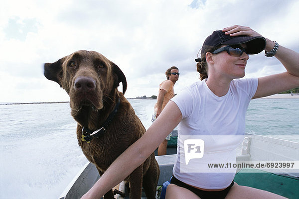 Couple Boating With Dog  Cayman Islands