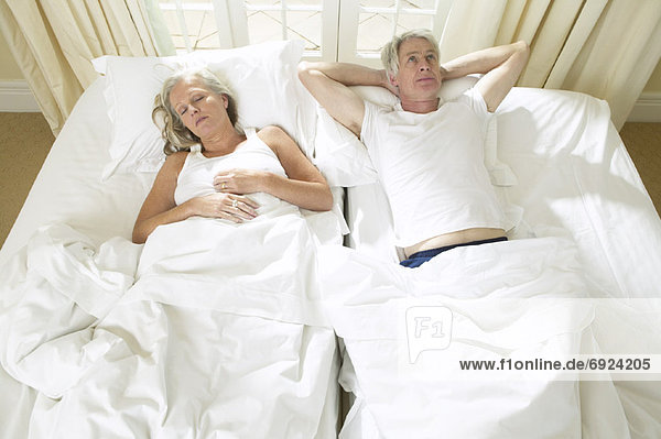 Mature Couple In Bed