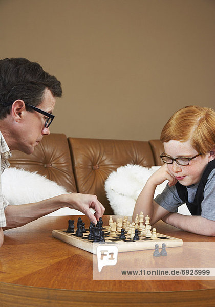 Father and Son Playing Chess